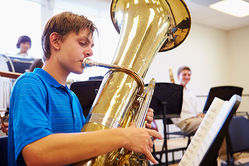 Student playing a tuba.